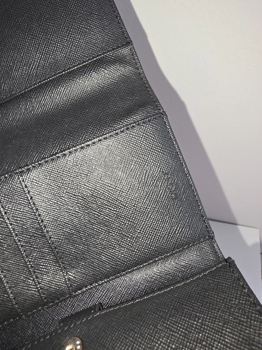 DKNY Black Leather Wristlet Clutch with Silver Logo Accent